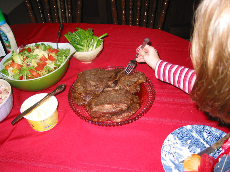 Holly 'steaks' her claim on a piece of Christmas meat