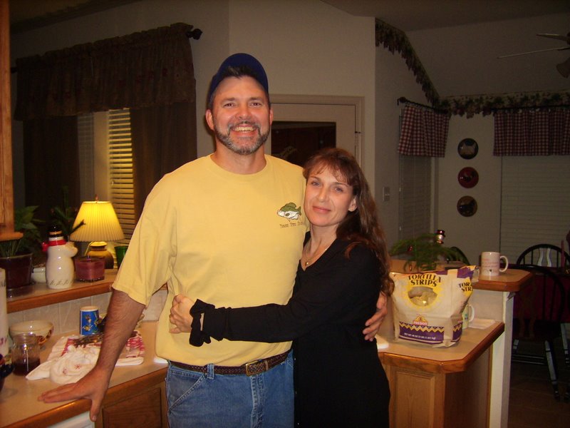 Joey and Denise in their annual anniversary photo in front of the sink