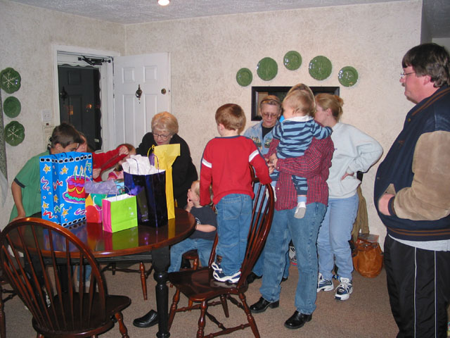 Lots of people watching the gift-opening