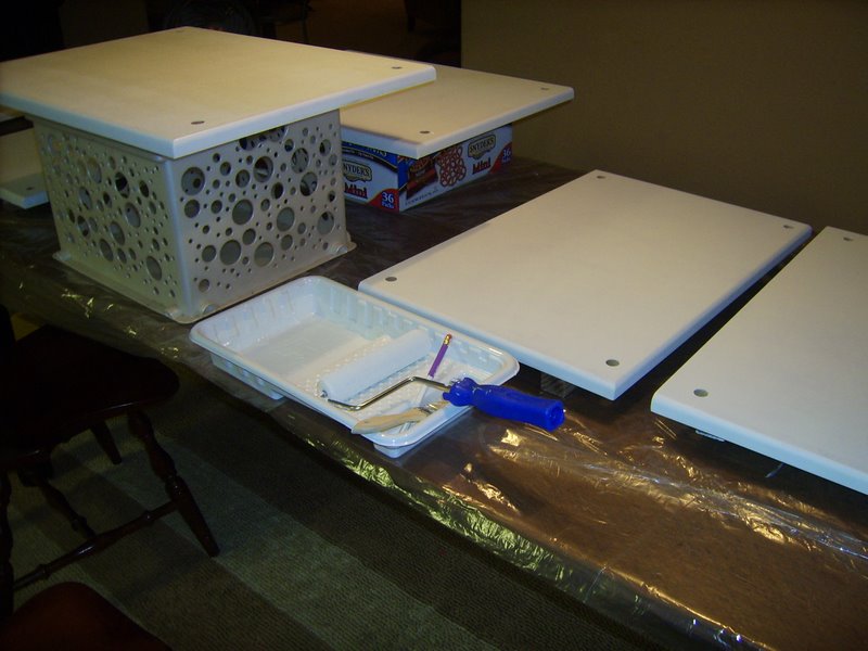 Putting a coat of Kilz primer on the shelves