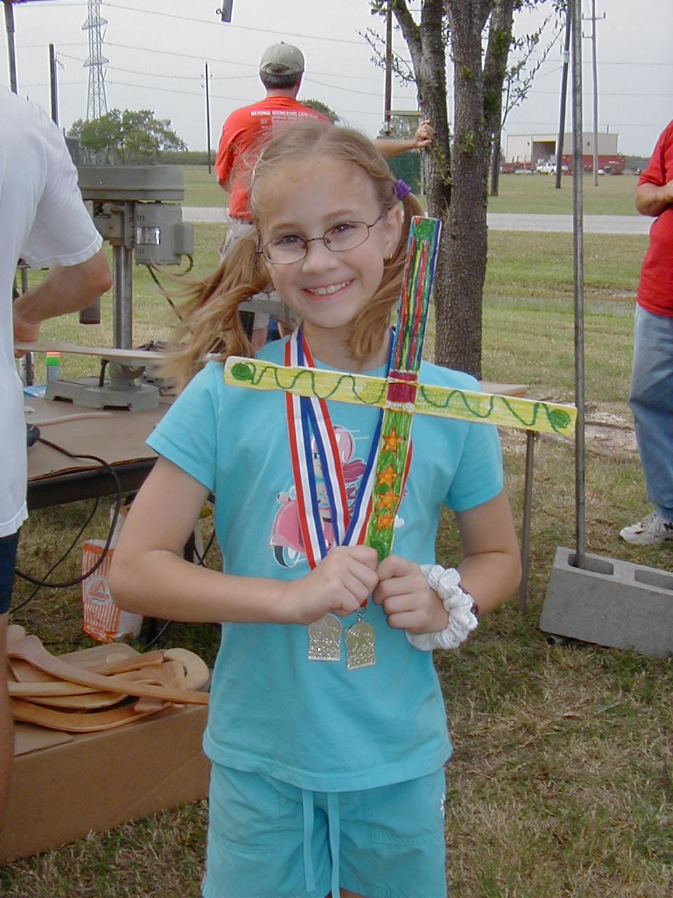 Holly at the workshop with her paint stick boomerang