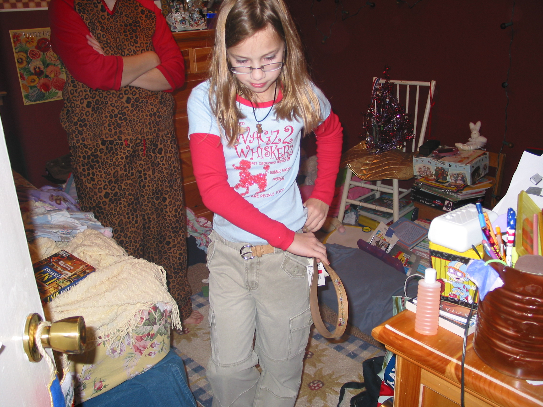 Holly trying on Christmas clothes.