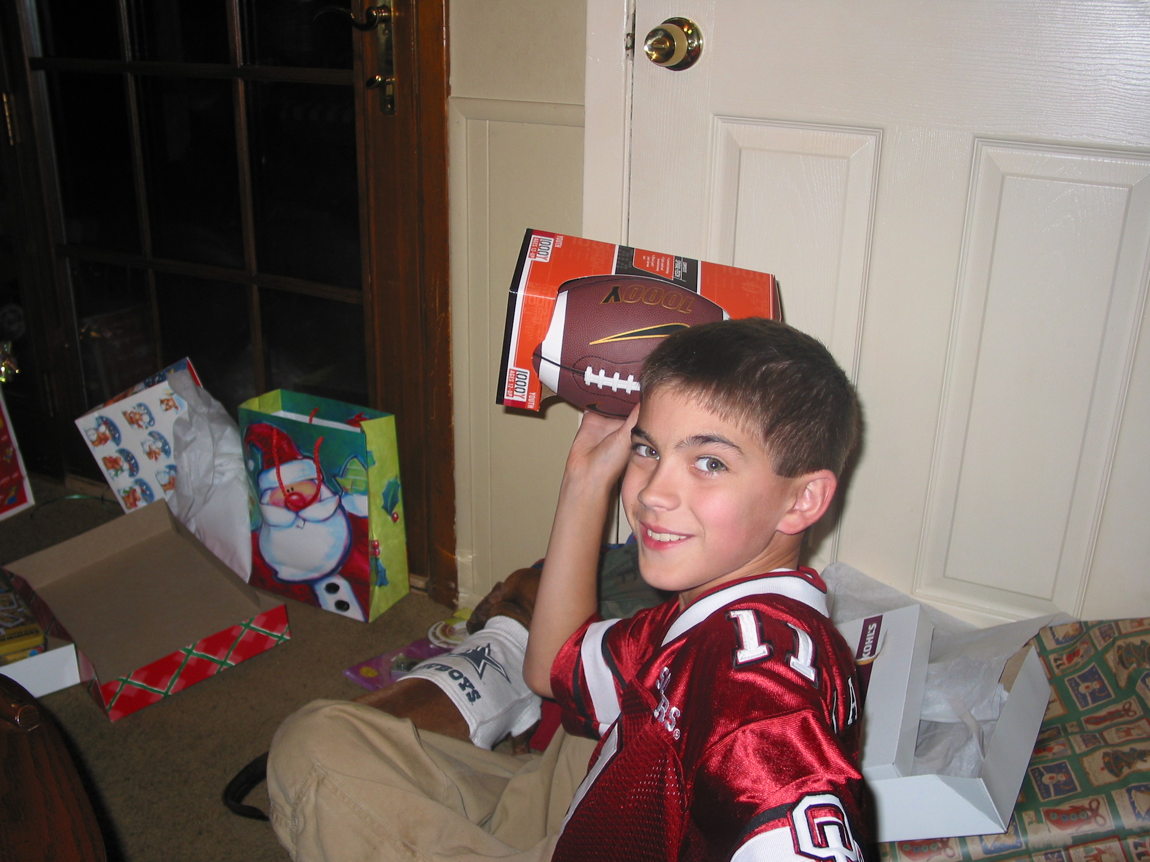 Joey's football gift is a perfect complement to Andrew's OU Sooner jersey.