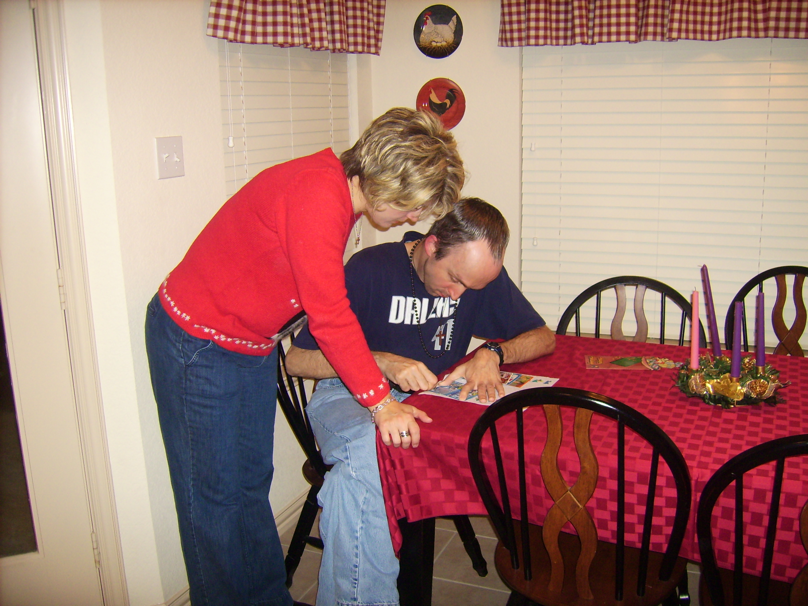Michelle watches Chris scratch off