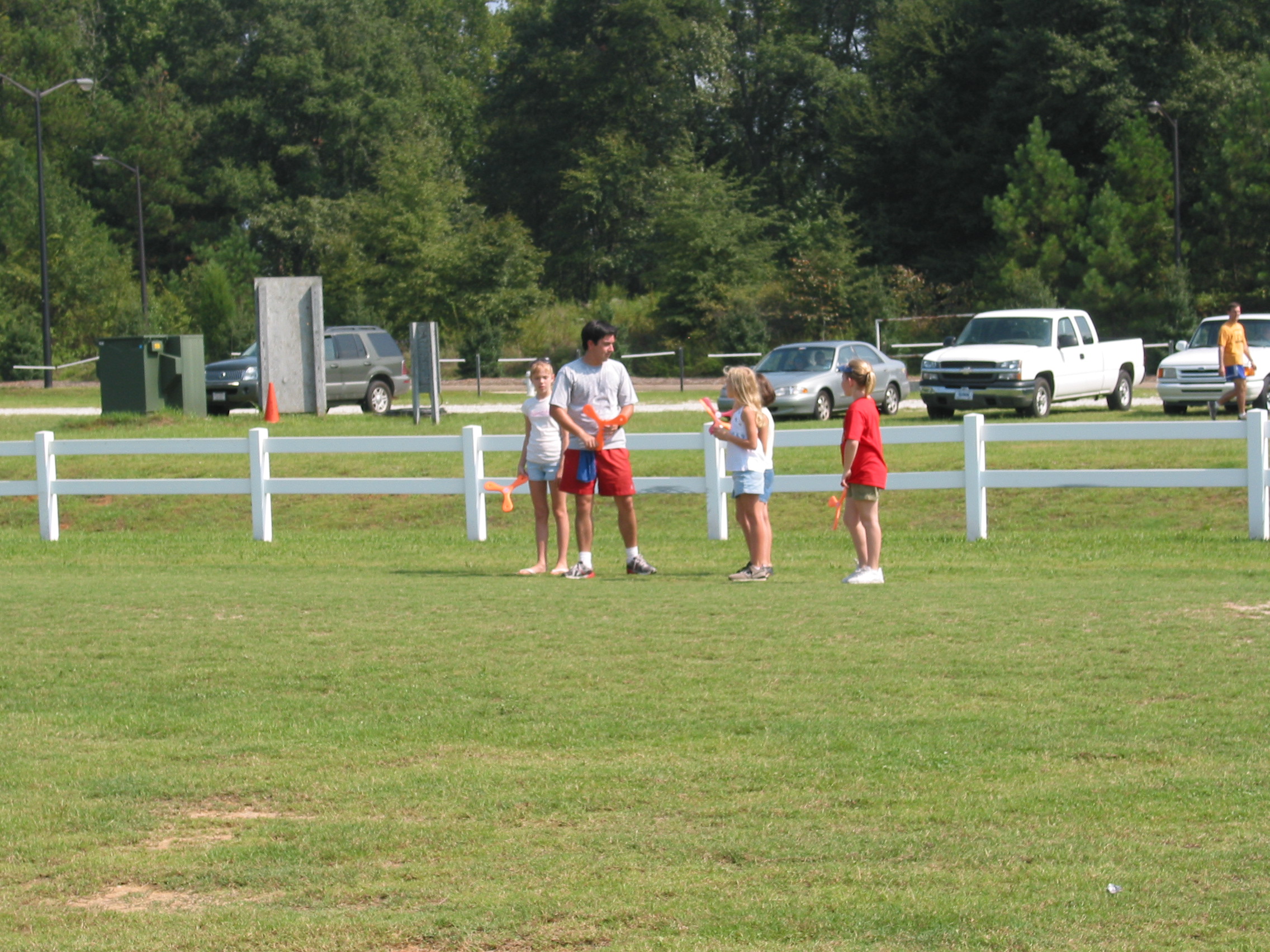Ricardo teaching four young ladies to throw
