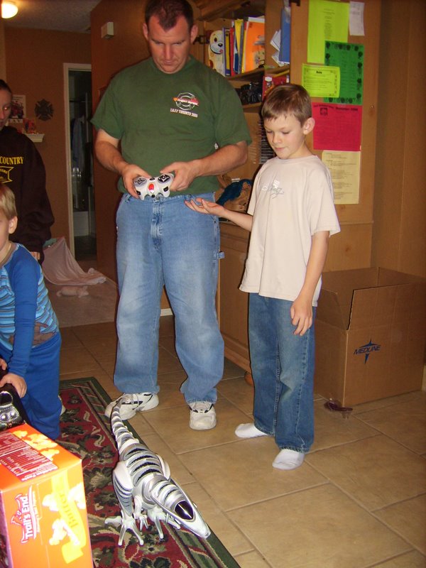 Joe remote controls a dinosaur