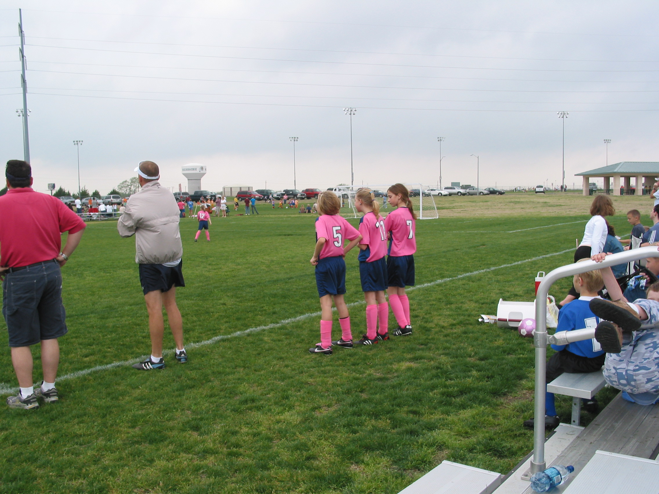Lulu, Macie, and Holly on the sidelines
