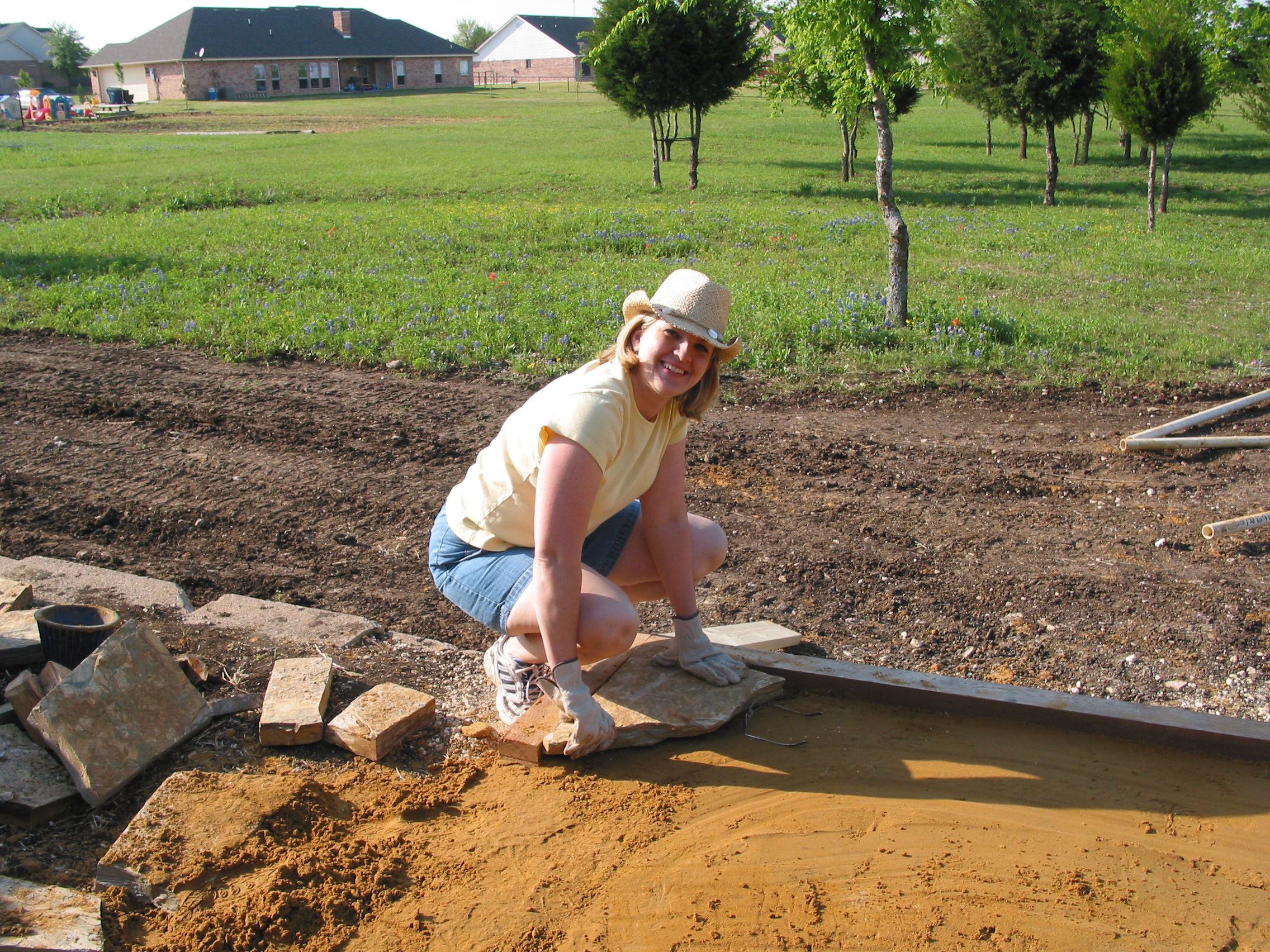 Michelle lays the first stone