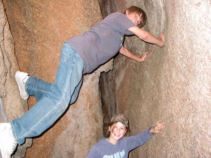 Andrew climbs a cave wall using his alleged Ninja skills
