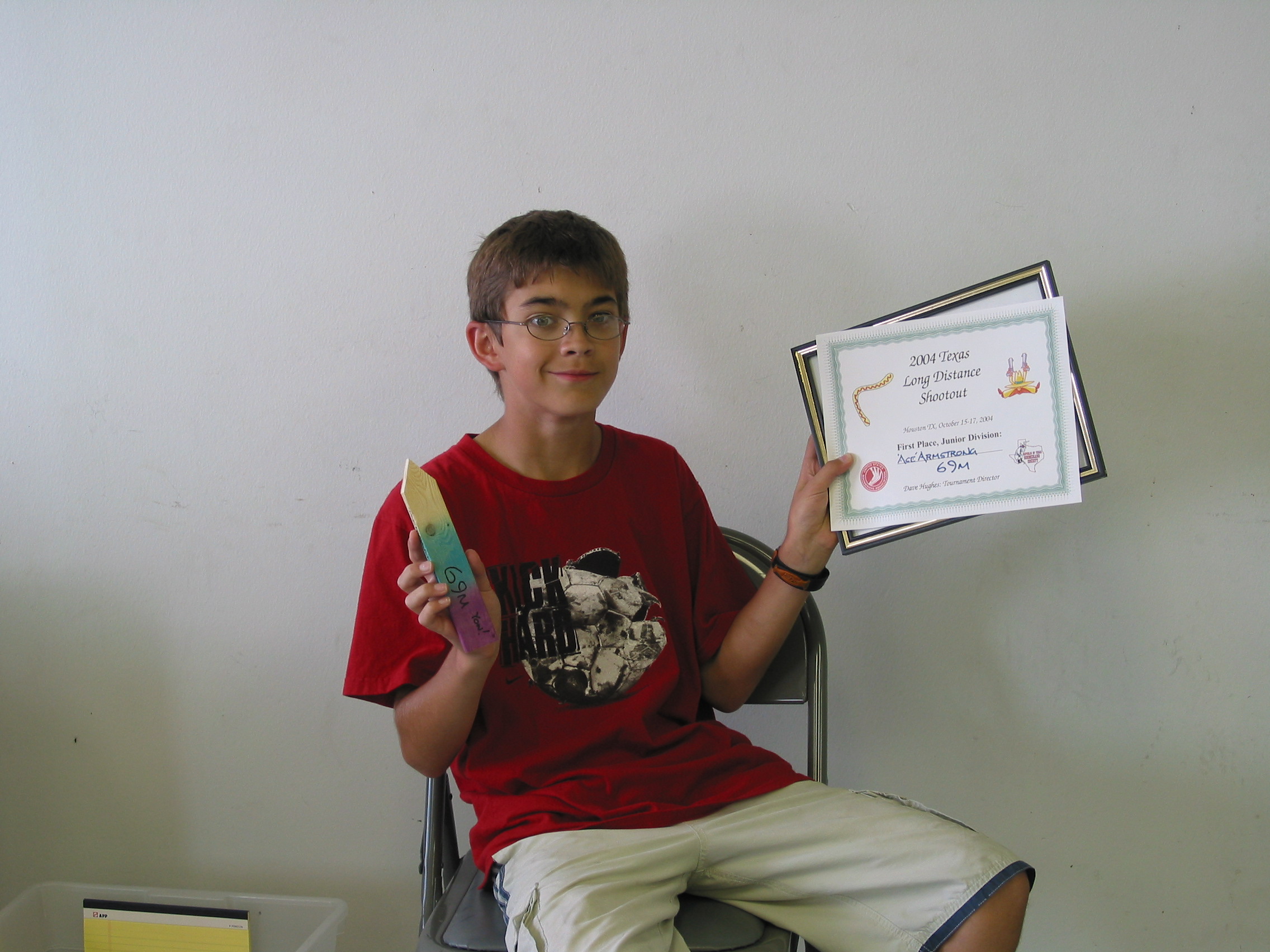 Ace with his stake and "Junior Champion" certificate. He threw 69 meters!