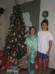Andrew and Holly with Christmas Tree 2002.jpg (109686 bytes)
