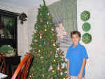 Holly's photo of Andrew by the 2001 Christmas tree_800x600.jpg (124003 bytes)