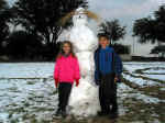 The Kids still with our Snowman Feb 2002.jpg (243452 bytes)
